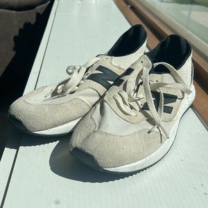 New Balance navy and cream running shoes.